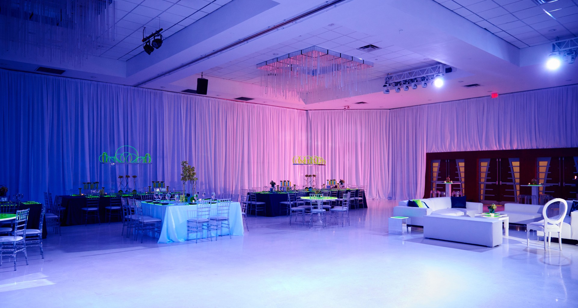 Luxury party room set up for a wedding or social event draped walls